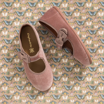 Dusty rose velvet Mary Jane shoes for toddlers with decorative bows and rounded toes.