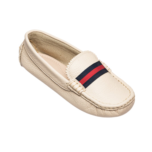 Cream leather toddler loafer with navy and red striped fabric band and moccasin stitching.