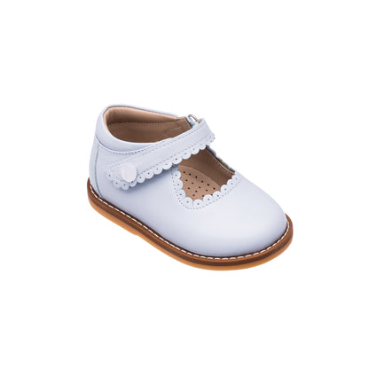 Light blue toddler Mary Jane shoe with scalloped strap and brown sole.