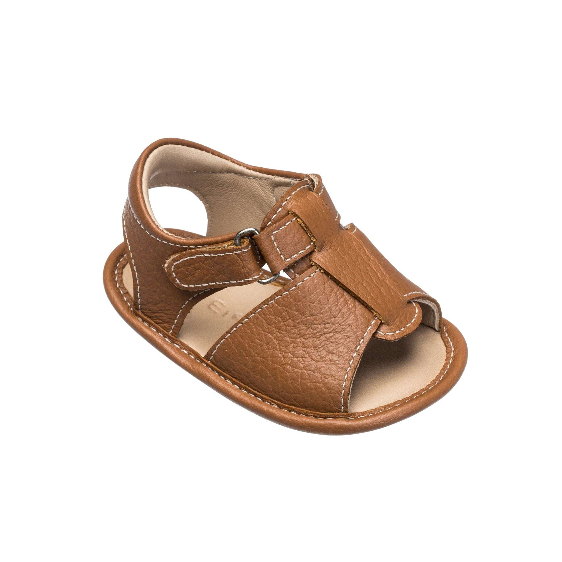 Caramel brown leather baby sandal with velcro strap and open toe design.