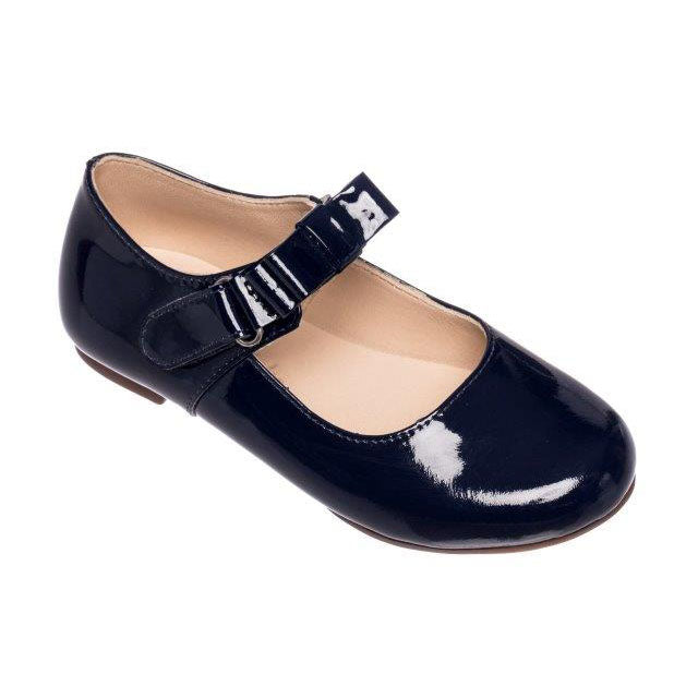 Glossy navy blue patent leather Mary Jane shoe with adjustable strap and rounded toe.