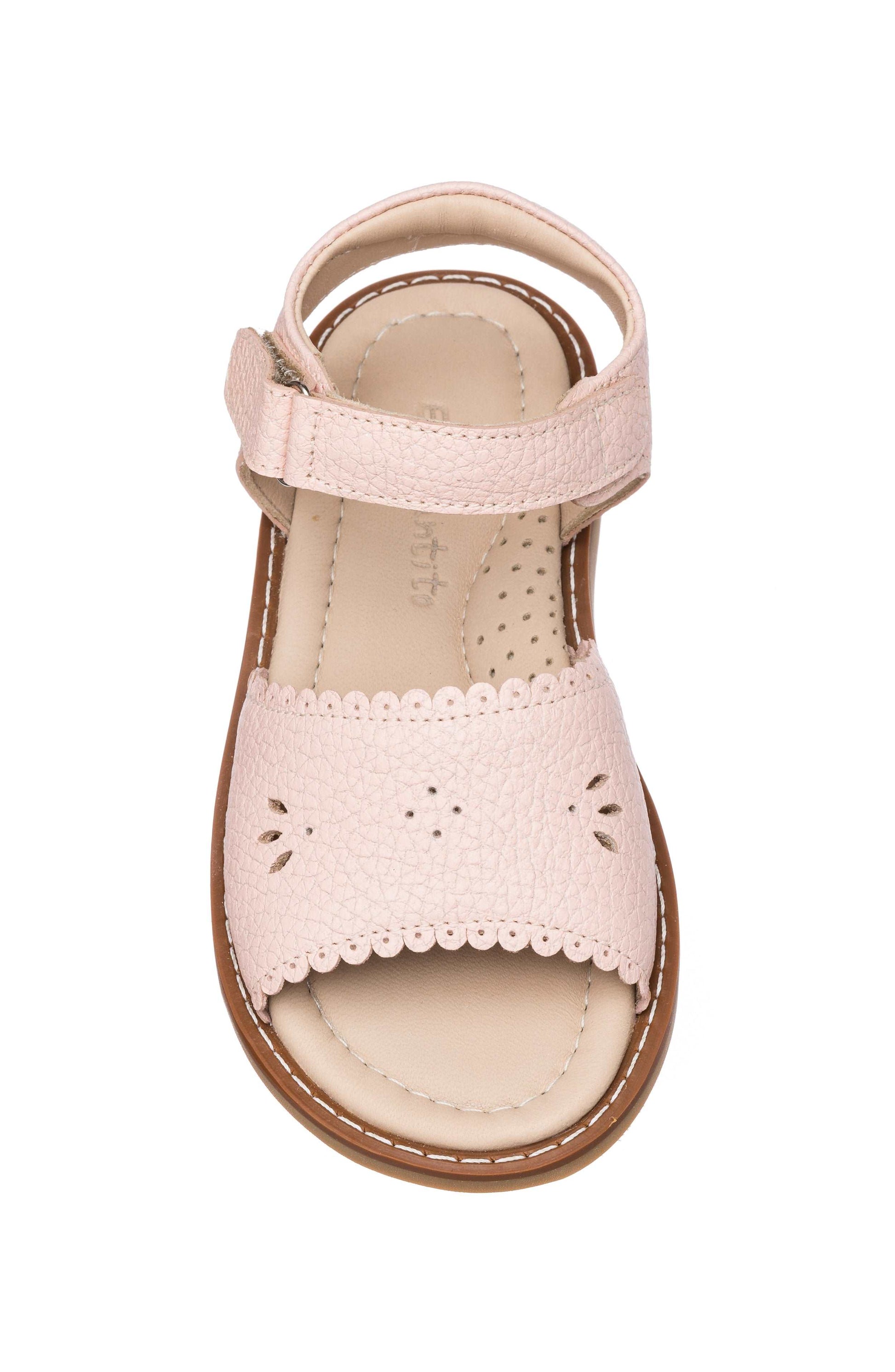 Pink toddler sandal with scalloped edges and flower cutout on front strap, adjustable ankle strap.