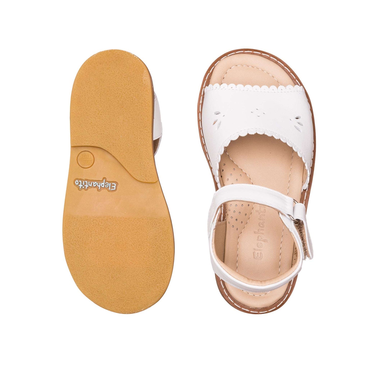 White toddler sandal with scalloped edges and adjustable ankle strap, tan sole with textured grip.