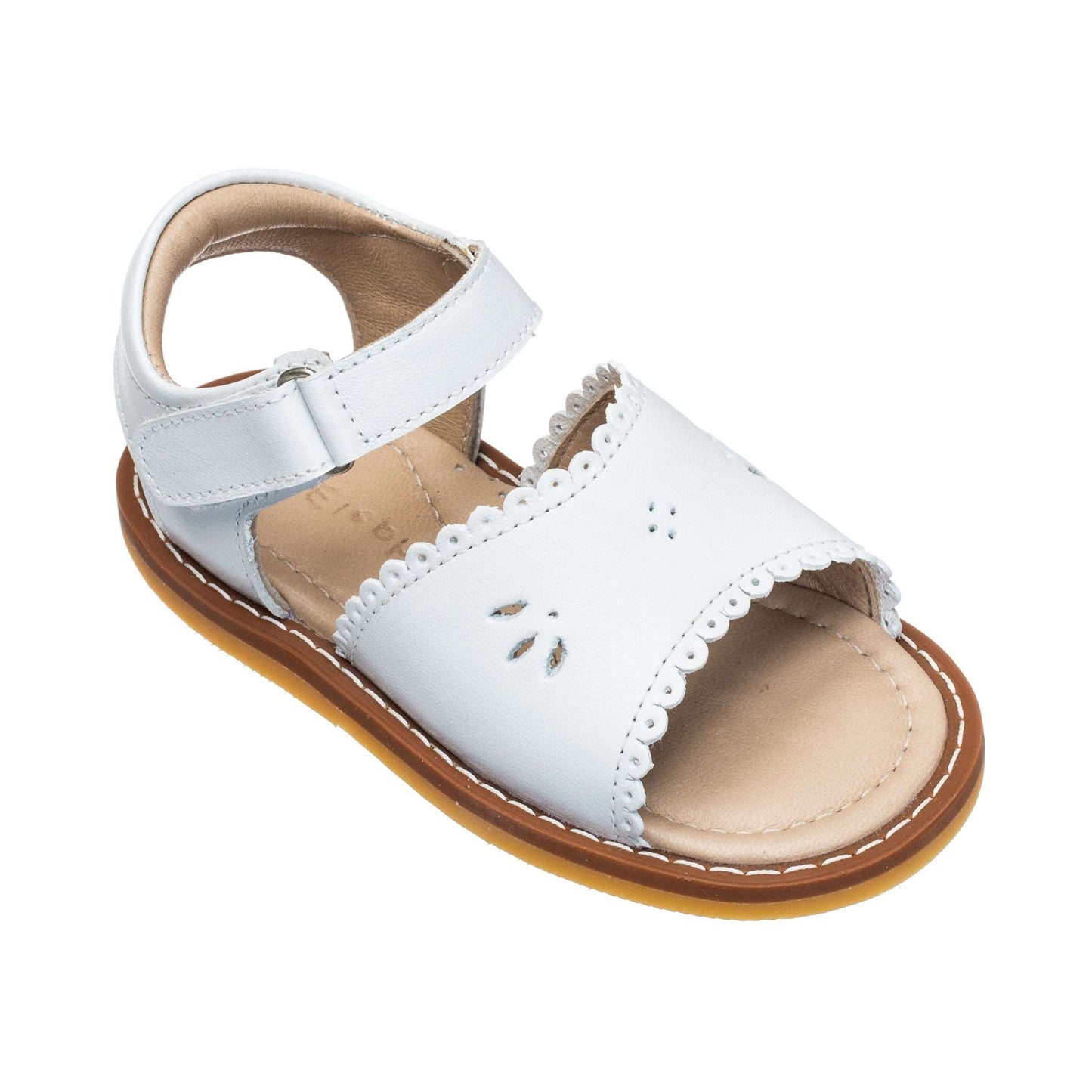 White toddler sandal with scalloped edge and perforated flower detail, adjustable ankle strap.