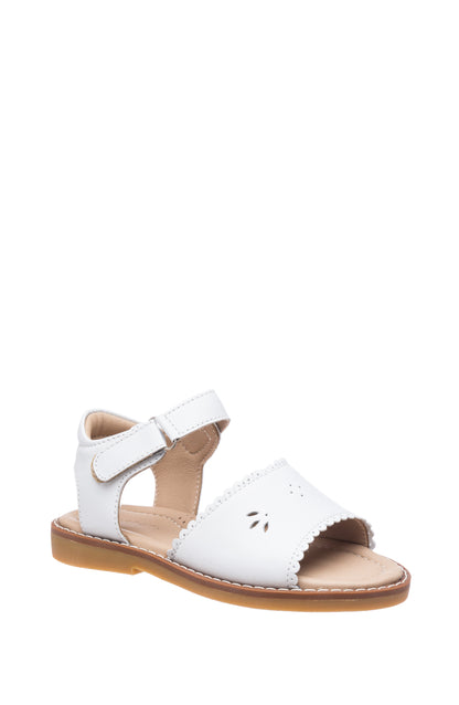 White leather children's sandal with scalloped edges and ankle strap on tan sole.