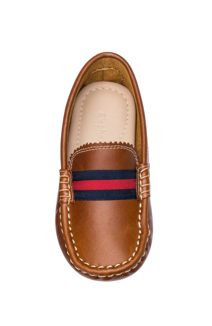 Natural brown leather baby loafer with navy and red striped fabric band and white stitching.