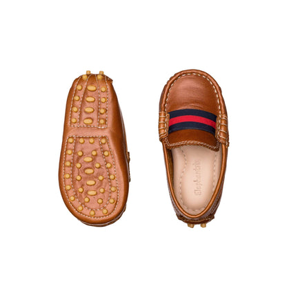 Natural brown toddler loafer with striped navy and red band and rubber nubs sole.