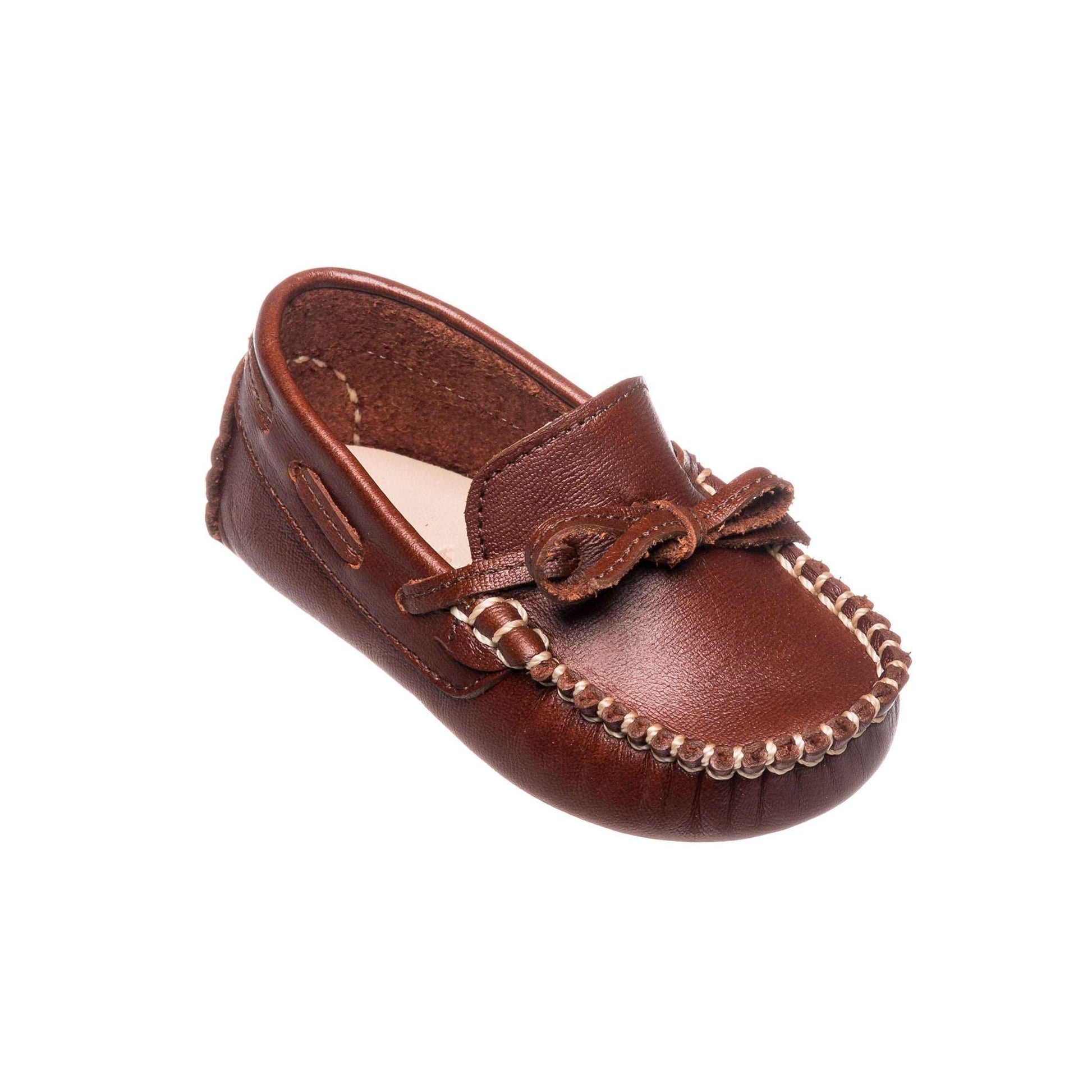 Brown leather baby driver loafer with stitched toe and decorative bow on top.