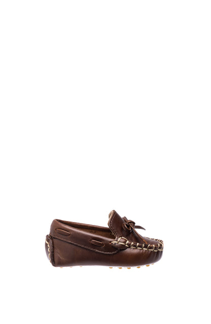 Brown leather baby loafer with moccasin stitching and front lace detail.