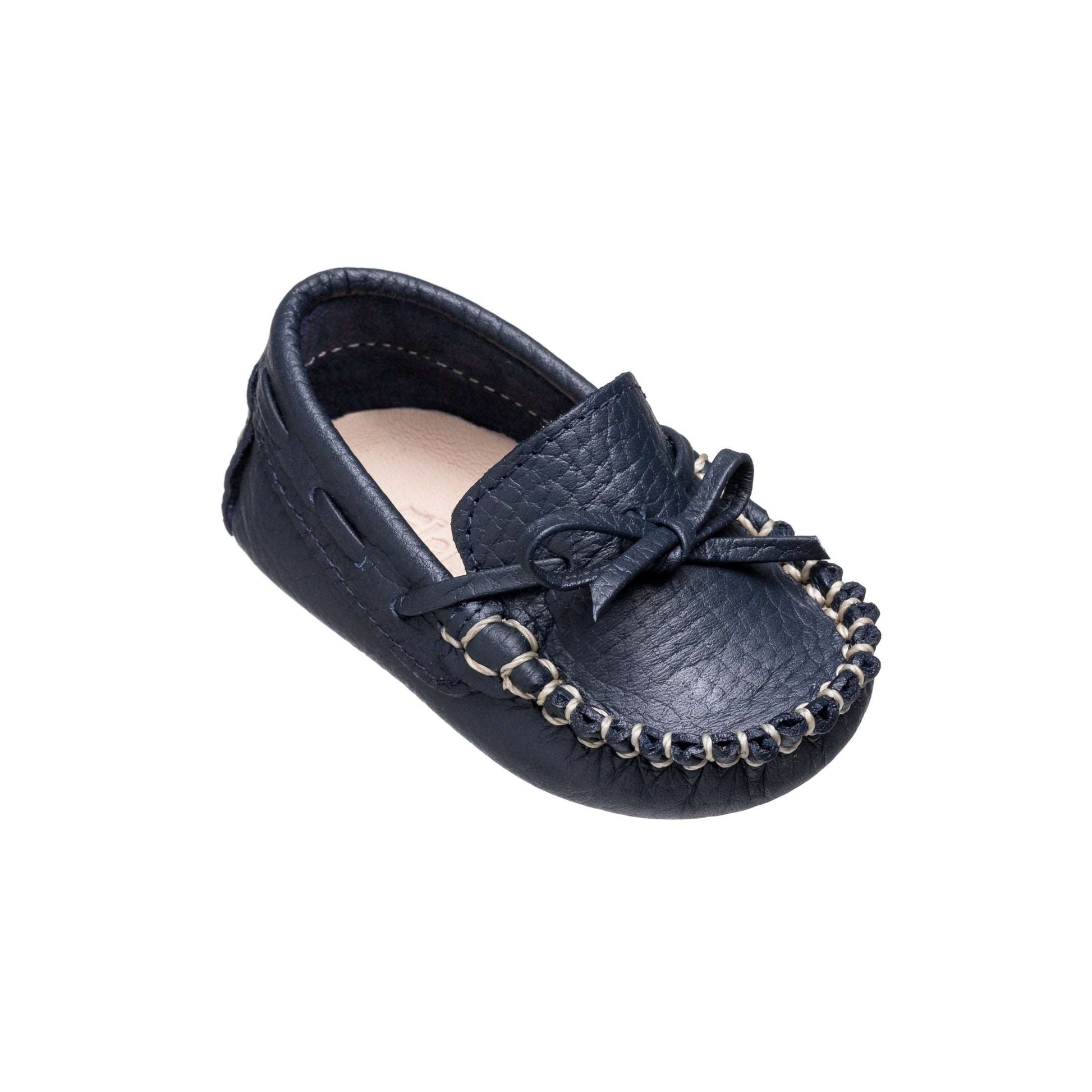 Navy blue baby loafer with bow detail and stitched moccasin-style sole.
