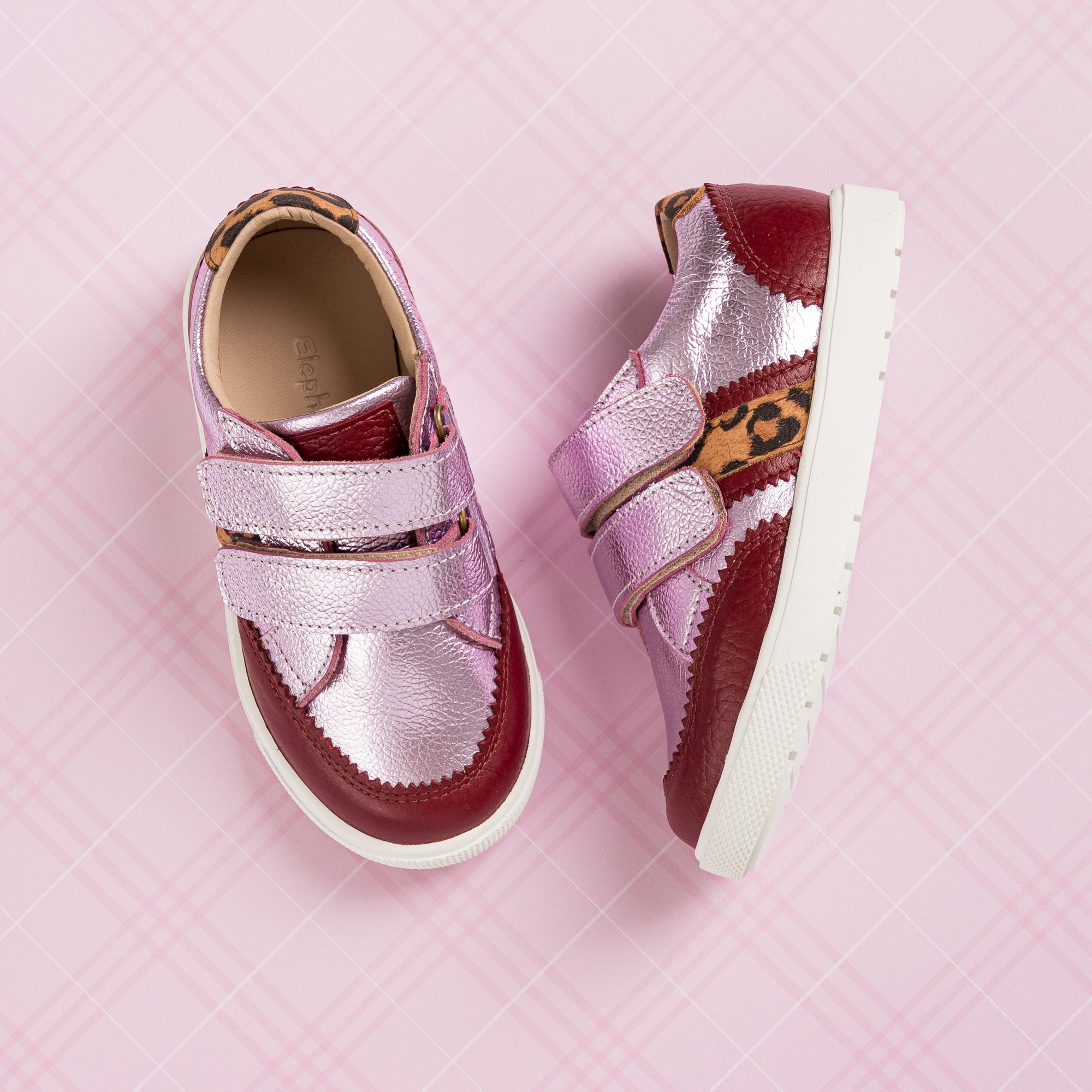 Metallic carnation pink girls' sneakers with double velcro straps and leopard print accent on white sole.
