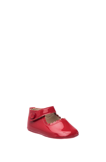 Red patent leather baby Mary Jane shoe with scalloped strap and hook-and-loop closure.