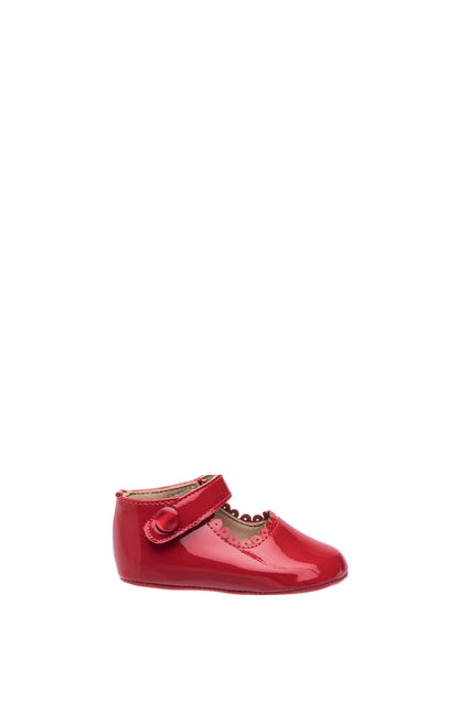 Red patent leather baby Mary Jane shoe with scalloped edges and velcro strap.