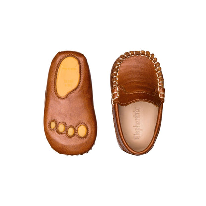 Natural brown leather baby moccasins with decorative stitching and soft sole, infant sizes 0-4 M US.