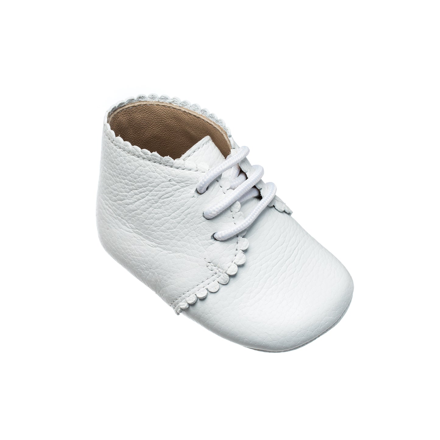 White leather baby bootie with scalloped edge and lace-up front.