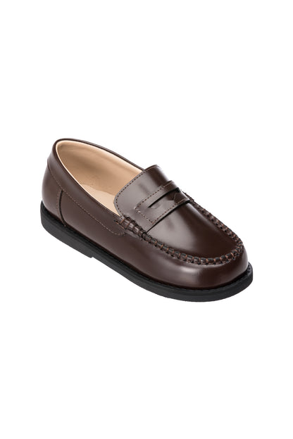 Brown leather boys’ moccasin loafers with penny strap and black rubber sole.