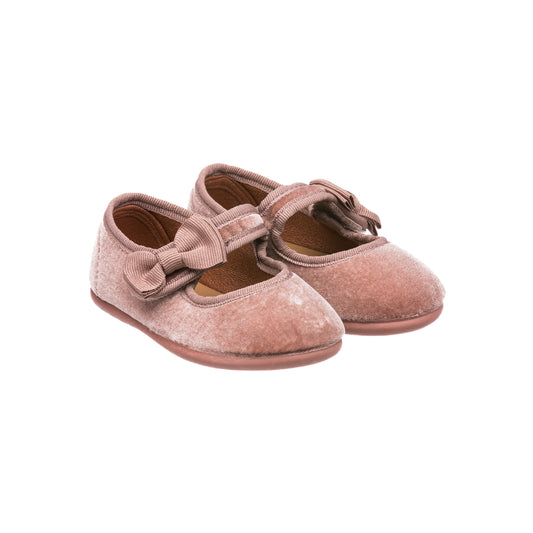 Pink velvet Mary Jane shoes for toddlers with bow detail and adjustable strap.